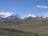 Tibet Kailash 03 Nyalam to Peiku Tso 03 Tong La Mountains As we ascended towards the Tong La (also called Yarle Shang La) from Nyalam, a beautiful mountain panorama unfolded. The Labuche Kang massif is part of the Himalayan range in Tibet, located North-West of Cho Oyu, and half-way between Cho Oyu and Shishapangma. This massif has several summits over 7000m, including the highest Labuche Kang at 7367m (also called Lobuche Kang I or Choksiam) and Labuche Kang II (7072m), both behind the mountain to the left. The broad mountain to the left is 6718m while the mountain partially poking out from behind is 6952m. Note that several websites and Michael Palins book Himalaya mistakenly call these mountains Cho Oyu, Menlungtse and Gauri Shankar  theyre not.